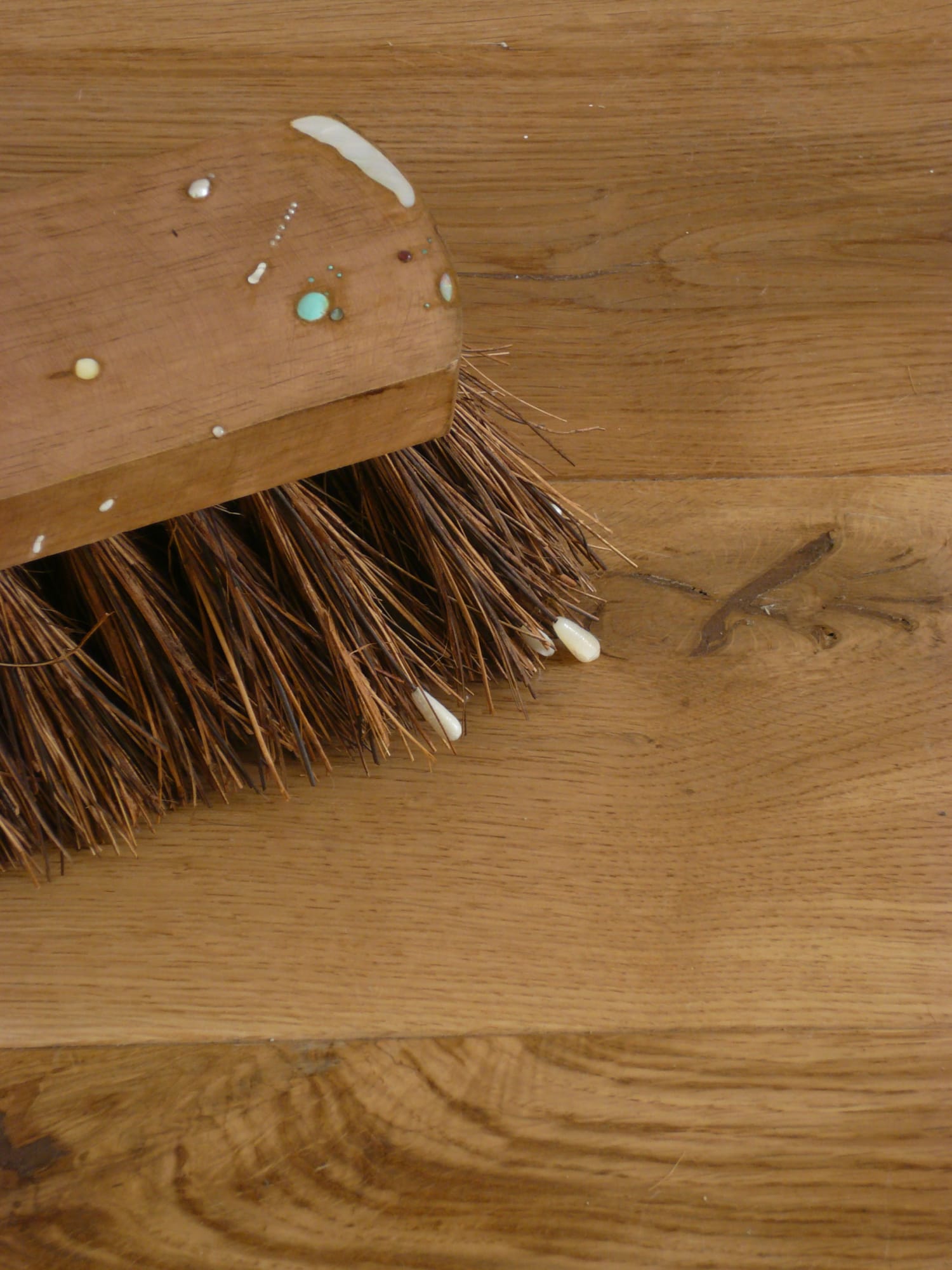 Love is A Charm of Powerful Trouble (Detail) 2008 wooden broom, white opal, yellow opal, Brazilian opal, cultured pearl, freshwater pearl, mother of pearl, white diamond, black diamond, sapphire, garnet, ruby, labradorite, moonstone, white howite, jadeite, citron cyrsoprase, turquoise, peridot, emerald